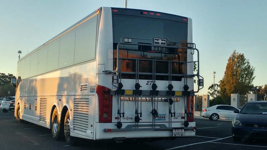 Bike racks seen on the back of a tech campus commuter bus