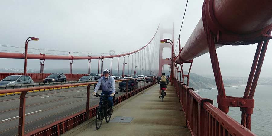 Commuters make their way across the Golden Gate Bridge